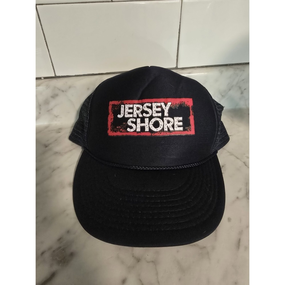 black Jersey Shore logo trucker hat features a mesh back